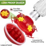 A red glass hummingbird feeder with star decorations, four feeding ports with perches, and a built-in ant moat.