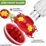A red glass hummingbird feeder with star decorations, four feeding ports with perches, and a built-in ant moat.