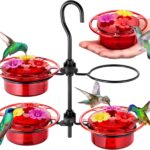 Four iBorn mini hummingbird feeders with red silicone flower feeding ports, hanging outdoors with a hummingbird nearby.