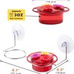 A vibrant red iBorn window hummingbird feeder with clear nectar reservoir, attached to a window pane via a large suction cup,