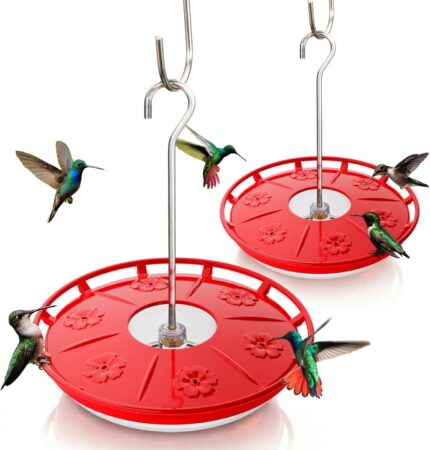 Two red Kingsyard saucer hummingbird feeders with clear bases and flower-shaped feeding ports, hanging outdoors.