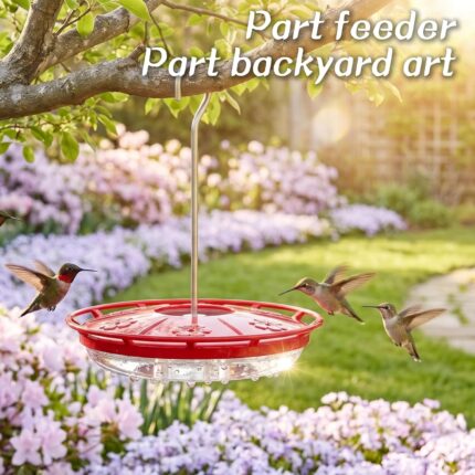 Two red Kingsyard saucer hummingbird feeders with clear bases and flower-shaped feeding ports, hanging outdoors.