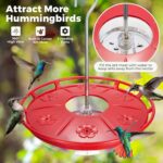 Two red Kingsyard saucer hummingbird feeders with clear bases and flower-shaped feeding ports, hanging outdoors.