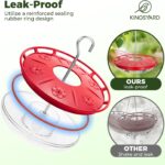 Two red Kingsyard saucer hummingbird feeders with clear bases and flower-shaped feeding ports, hanging outdoors.