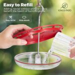 Two red Kingsyard saucer hummingbird feeders with clear bases and flower-shaped feeding ports, hanging outdoors.