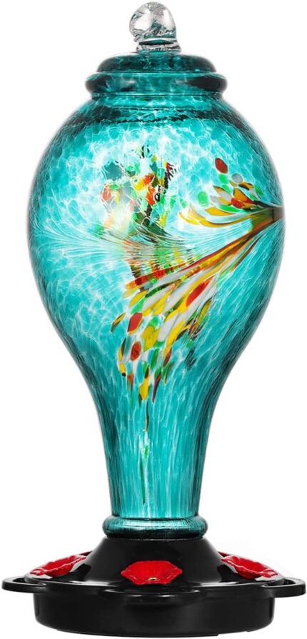 A vibrant blue hand-blown glass hummingbird feeder with five metal flower feeding ports and a built-in ant moat, hanging outd