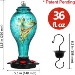 A vibrant blue hand-blown glass hummingbird feeder with five metal flower feeding ports and a built-in ant moat, hanging outd