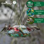 Vibrant blue sunset hand-blown glass hummingbird feeder with three feeding ports and a decorative hanging basket.