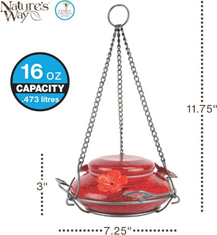 A vibrant red, hand-blown glass hummingbird feeder with a decorative hanging basket and three feeding ports.