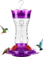 A vibrant purple glass hummingbird feeder with four flower-shaped feeding ports and a built-in ant moat, ready for hanging.