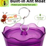 A vibrant purple glass hummingbird feeder with four flower-shaped feeding ports and a built-in ant moat, ready for hanging.