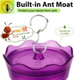 A vibrant purple glass hummingbird feeder with four flower-shaped feeding ports and a built-in ant moat, ready for hanging.