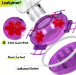 A vibrant purple glass hummingbird feeder with four flower-shaped feeding ports and a built-in ant moat, ready for hanging.
